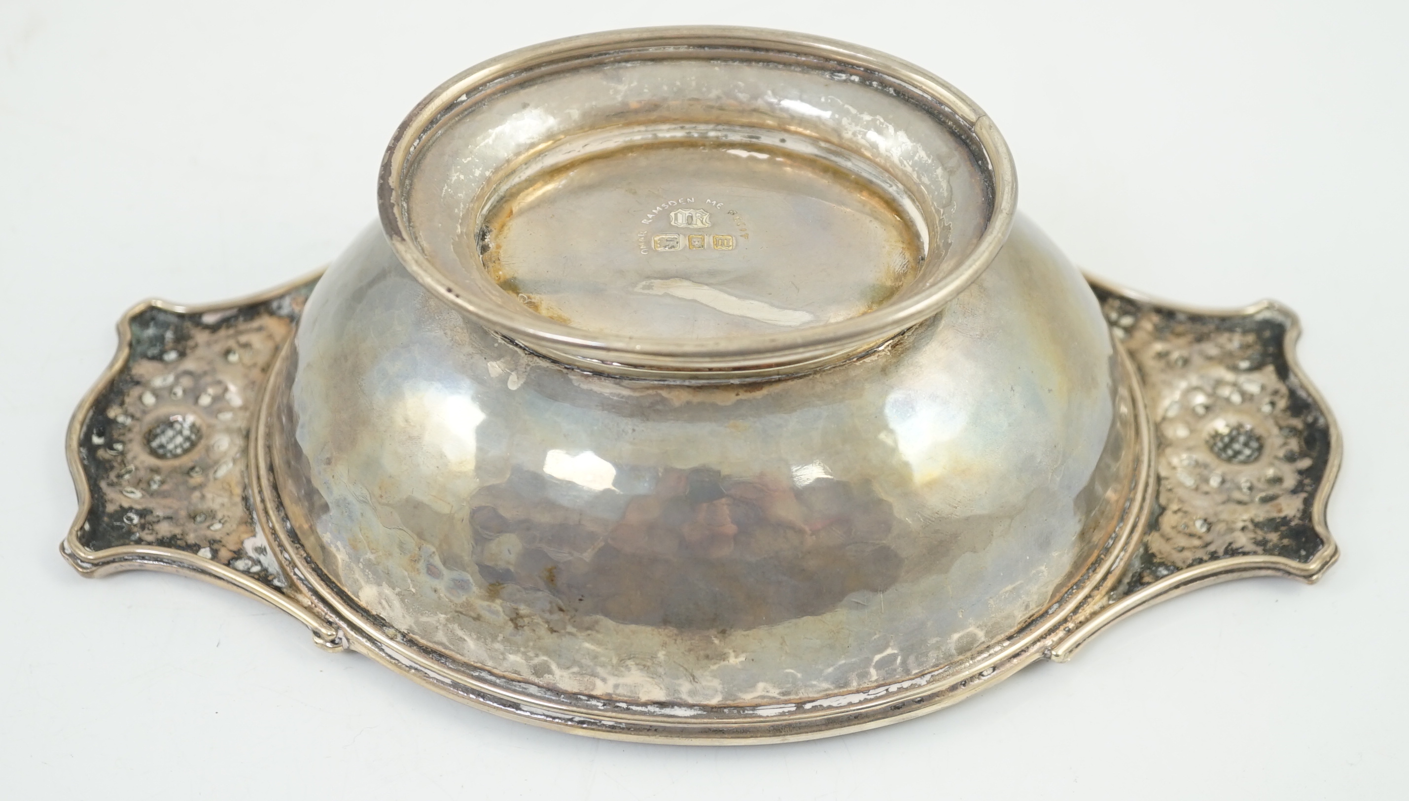 A George V Arts & Crafts planished silver two handled oval bowl by Omar Ramsden